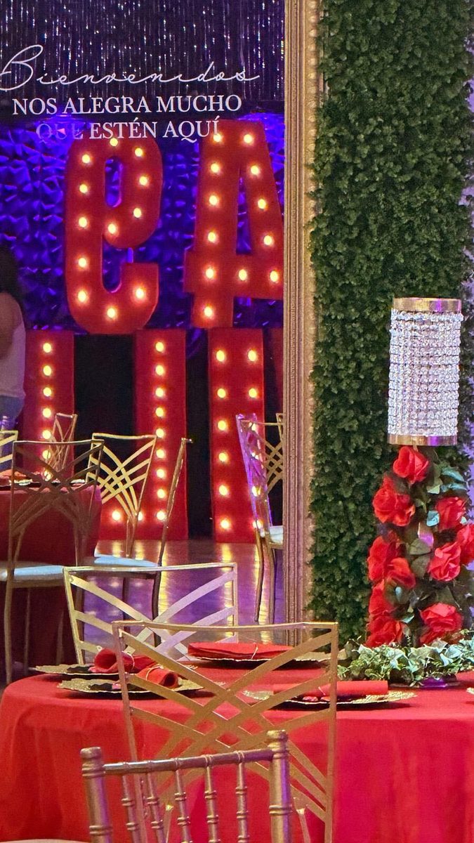 A bold red celebration with marquee letters and roses