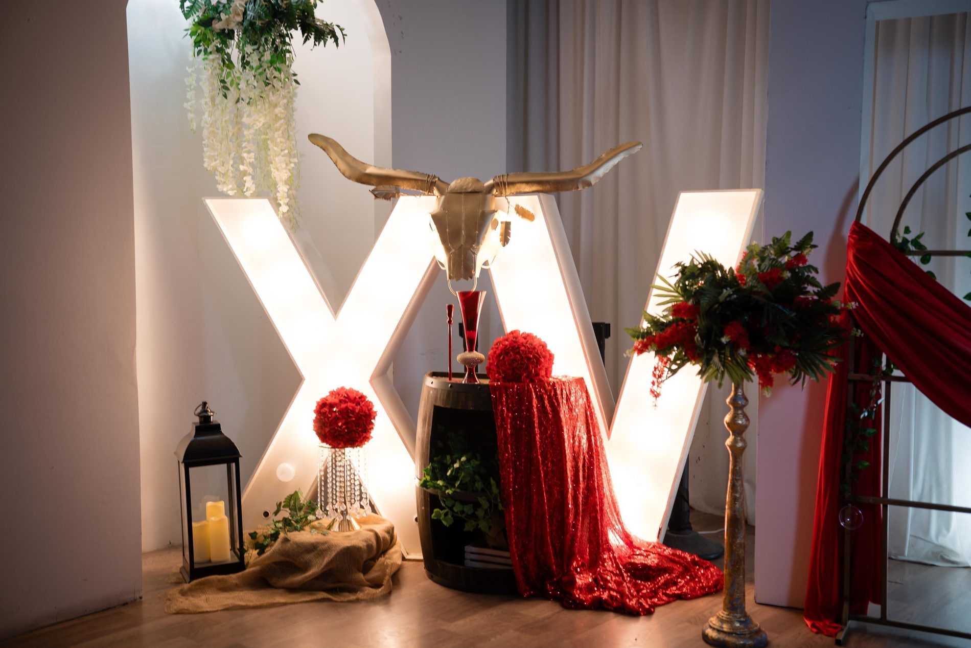 Glowing XV marquee letters on a custom themed display
